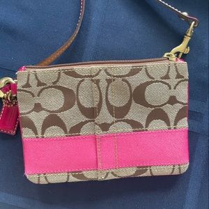 Coach signature strip wristlet brown with pink.